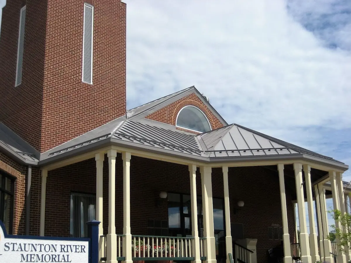 Skilled roofing craftsmen working on a residential roof in Bowling Green